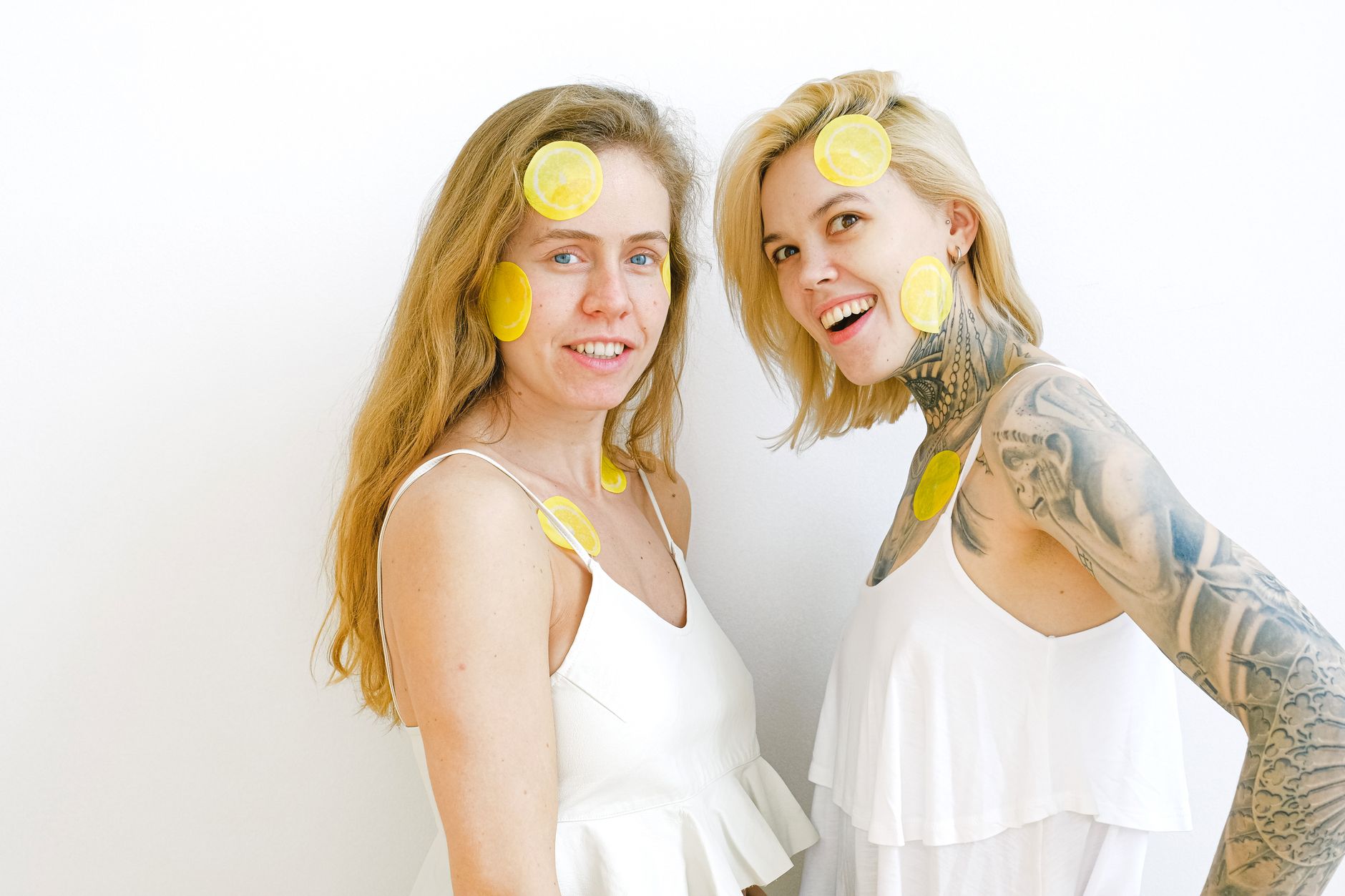 Colorful vibrators and intimate wellness products arranged on a bright yellow background